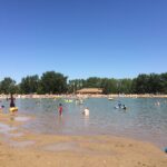 Sandy beach at the north end of Sikome Lake in Fish Creek Provincial Park, the public beach near Sundance